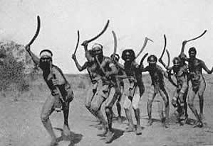 Aboriginal men holding boomerangs