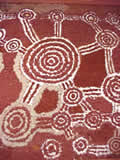 Sand painting with feathers